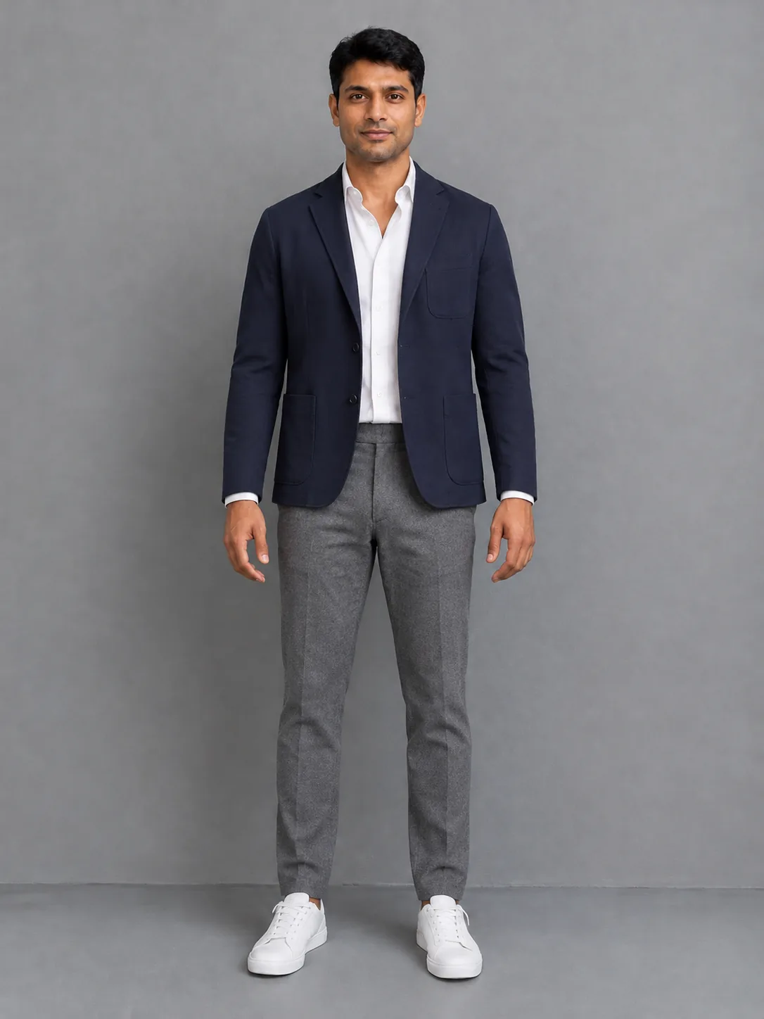 The same man in an unstructured navy jacket