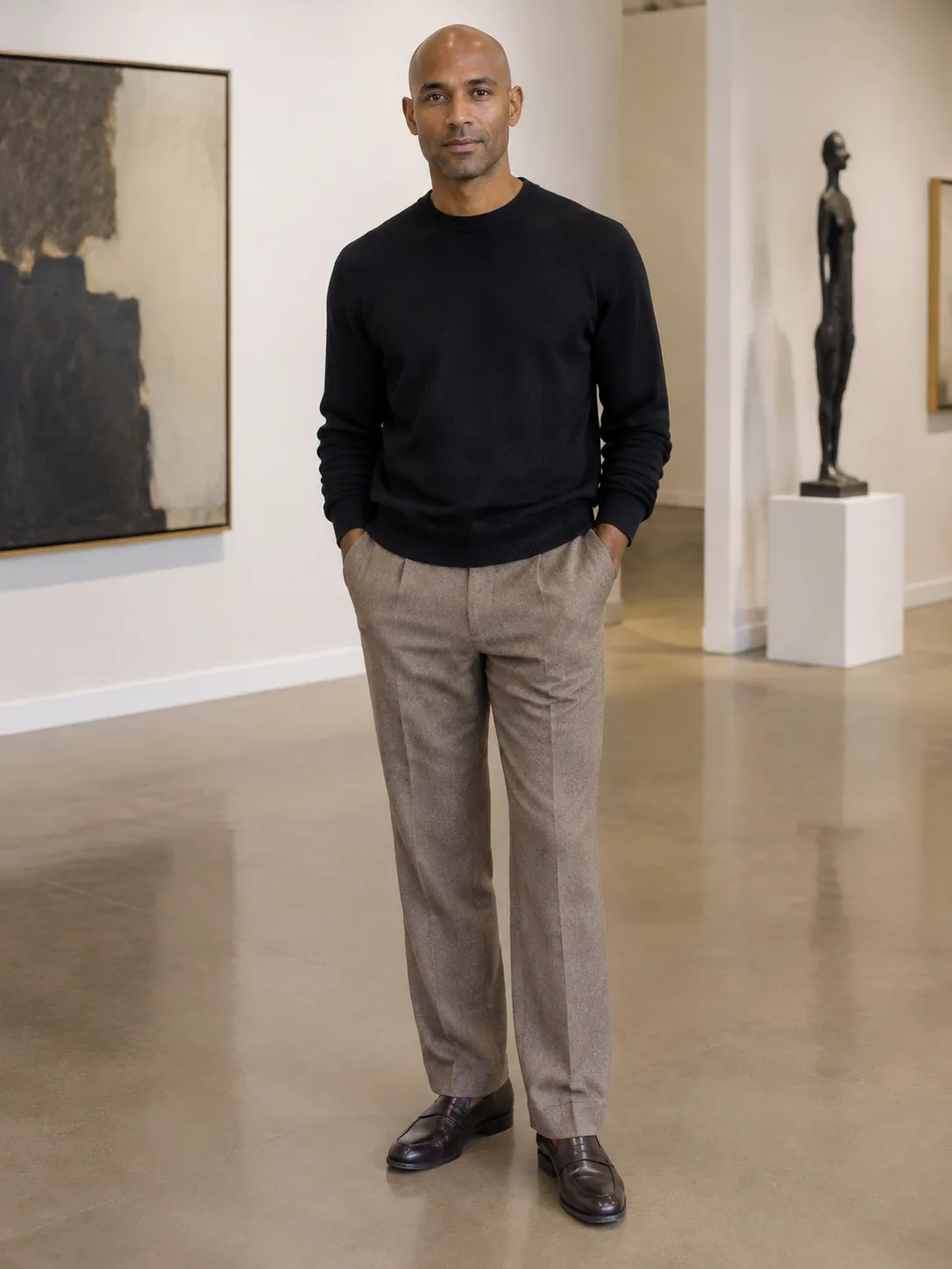 Adult man in a black knit and trousers