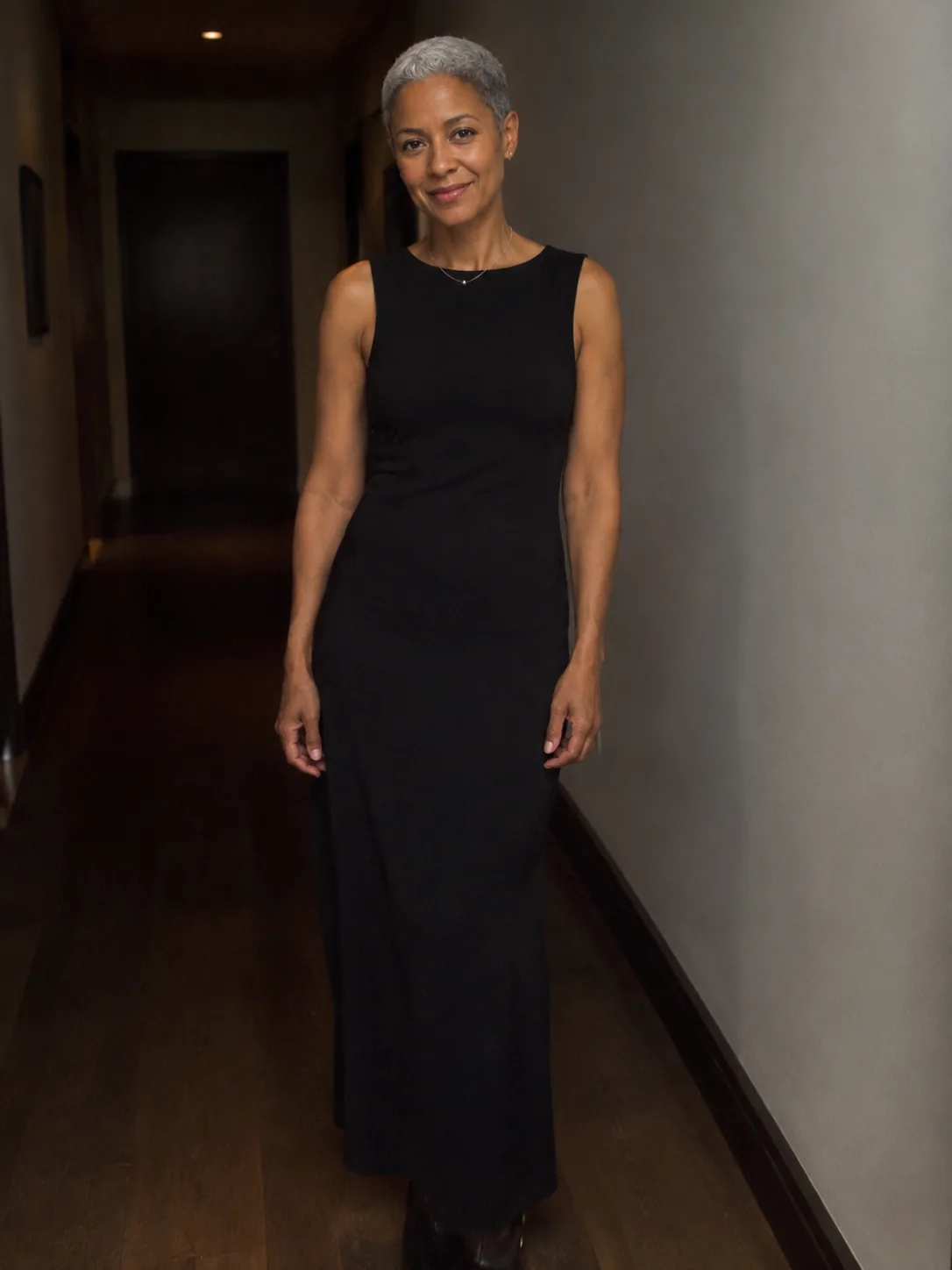 Adult person in a black column dress