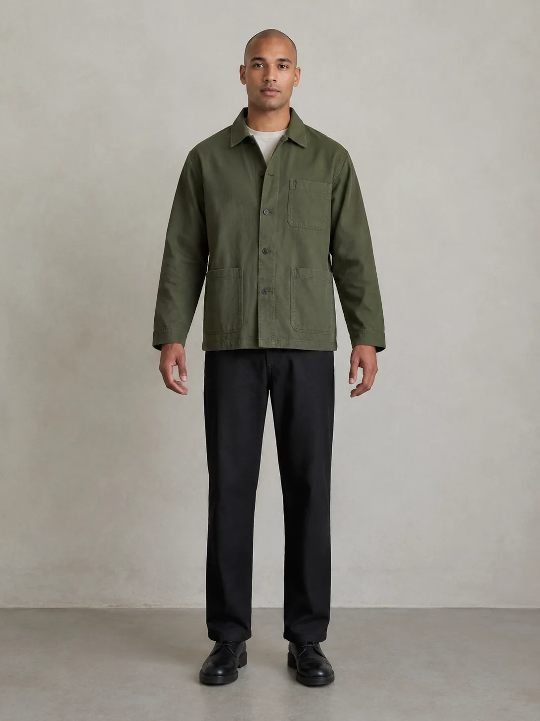 Adult person comparing two jacket lengths